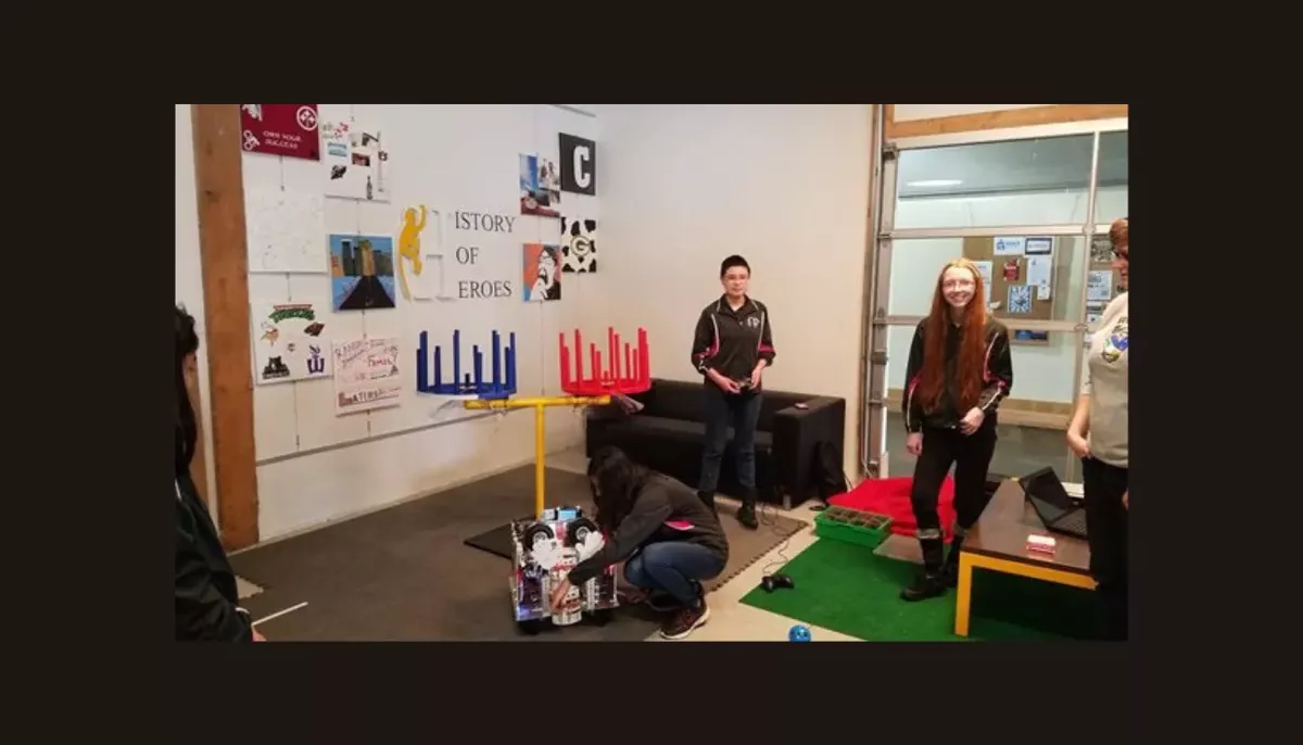 Three demonstrators with their robot