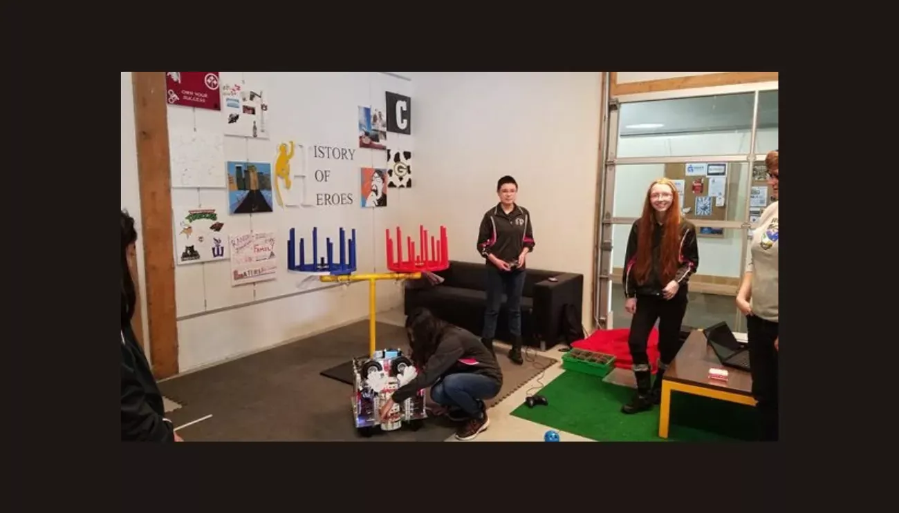 Three demonstrators with their robot