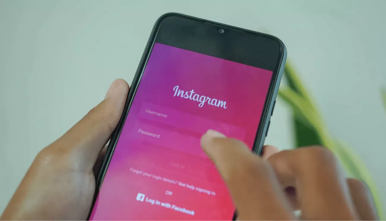 Person logging into Instagram on their phone