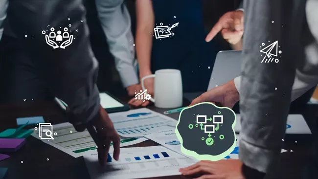 A team reviewing charts and documents on a table. High Monkey’s service icons are overlaying the image, the collaboration icon is highlighted.