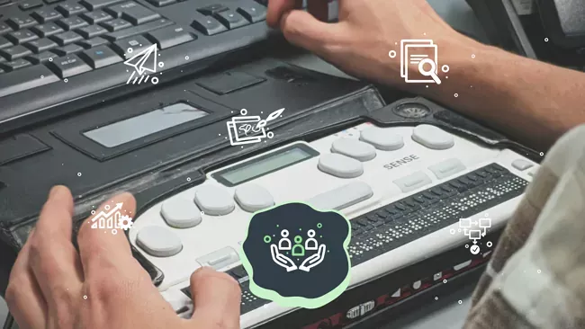 Hands using an accessibility oriented keyboard. High Monkey’s service icons are overlaying the image, the inclusive design icon is highlighted.