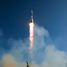 A rocket flying into the sky.