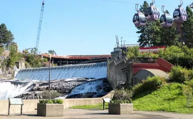 A waterfall with a staircase nearby