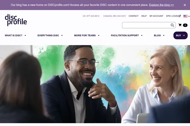 Smiling professionals in a meeting, representing teamwork and collaboration on the DISC Profile website.